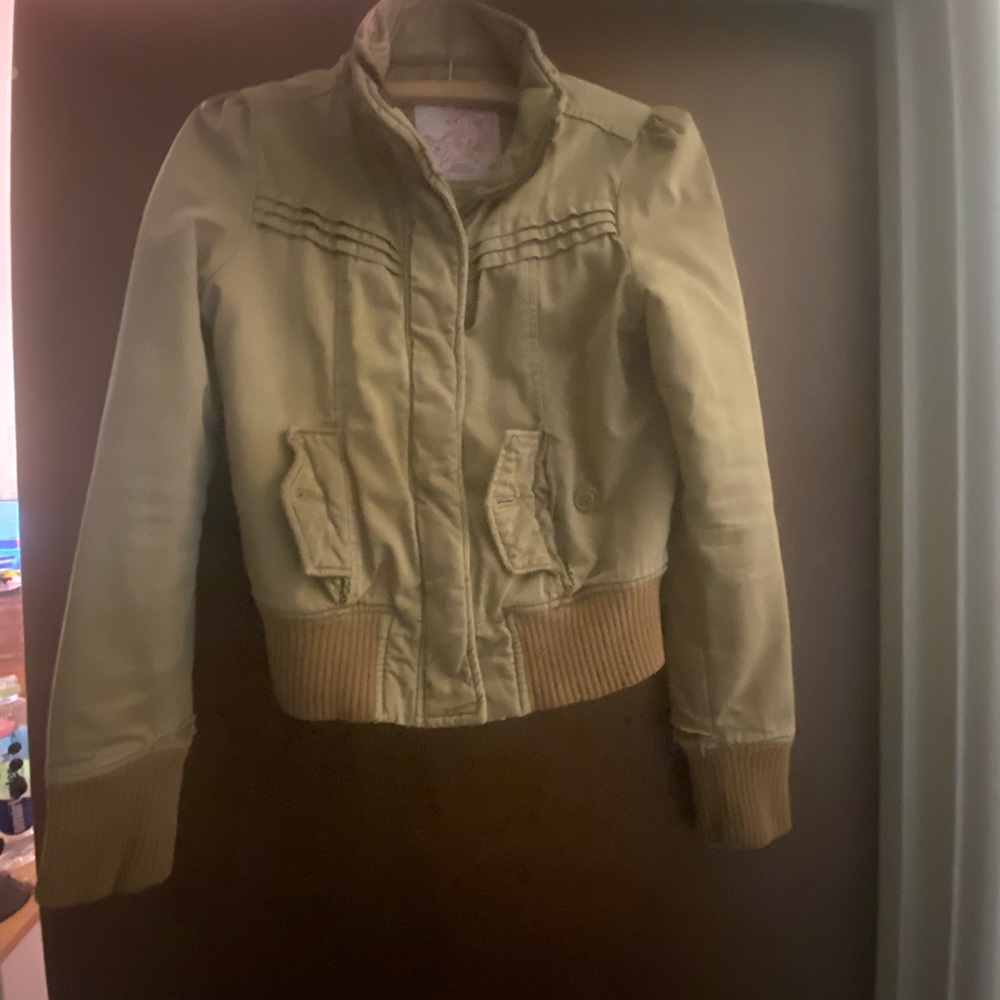 Woman’s khaki colored spring jacket